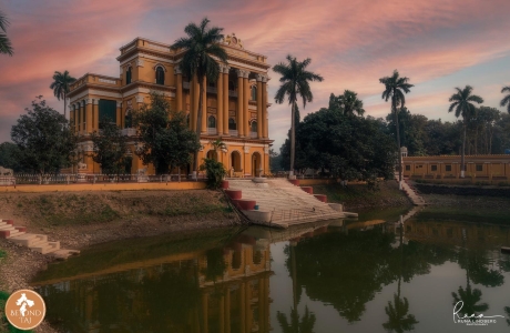 Kathgola Bagan Bari reflected in its garden pond at sunset