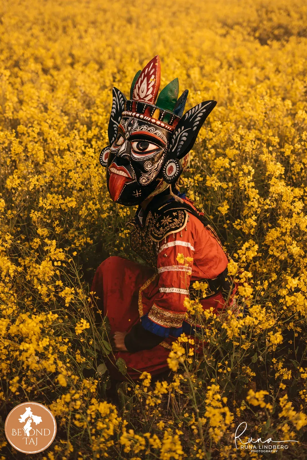 Gomira dance with kali mask in mustard field